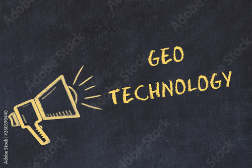 Chalk board sketch with handwritten text geo technology photo