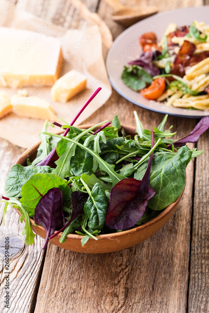 Fresh salad in ceramic bowl, healthy plant-based meal Fresh salad in ceramic bowl, healthy plant-based meal