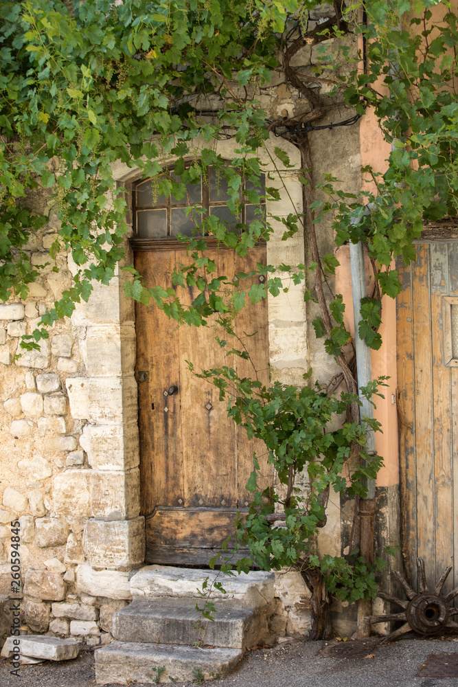 old tenement house overgrown with ivy in Sault, Vaucluse department in Provence region, France old tenement house overgrown with ivy in Sault, Vaucluse department in Provence region, France