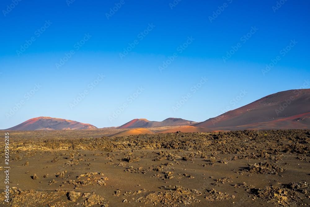 Spain, Lanzarote, Many colorful red volcano mountains in volcanic region of timanfaya