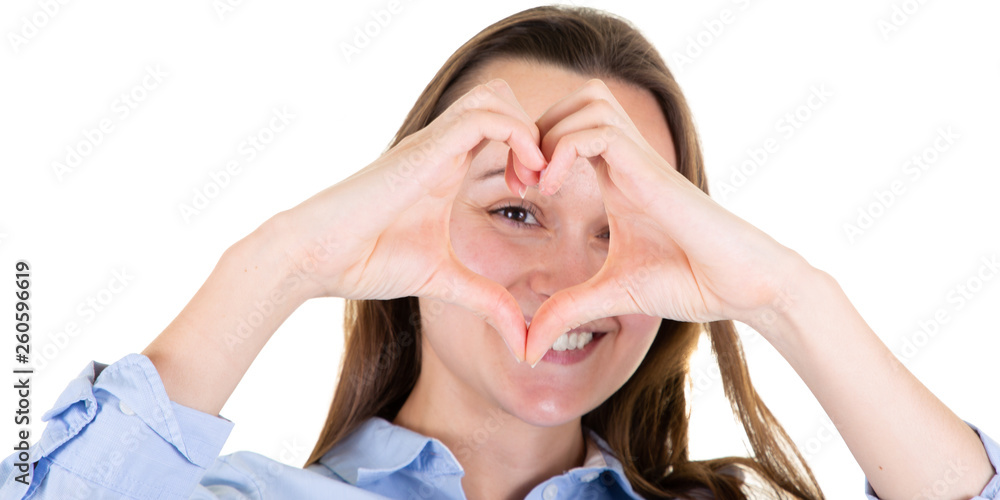 Beautiful happy young woman showing Love heart sign front eyes Beautiful happy young woman showing Love heart sign front eyes