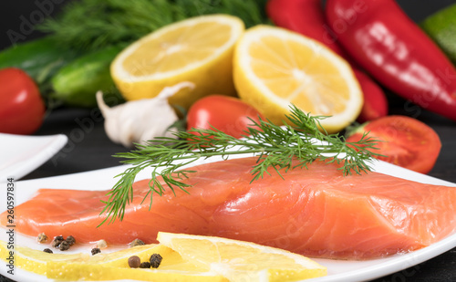 red fish with lemon on white plate