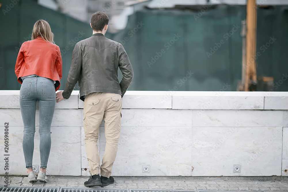 young family in the city on an autumn walk / lovers in jackets, walking in the autumn city young family in the city on an autumn walk / lovers in jackets, walking in the autumn city