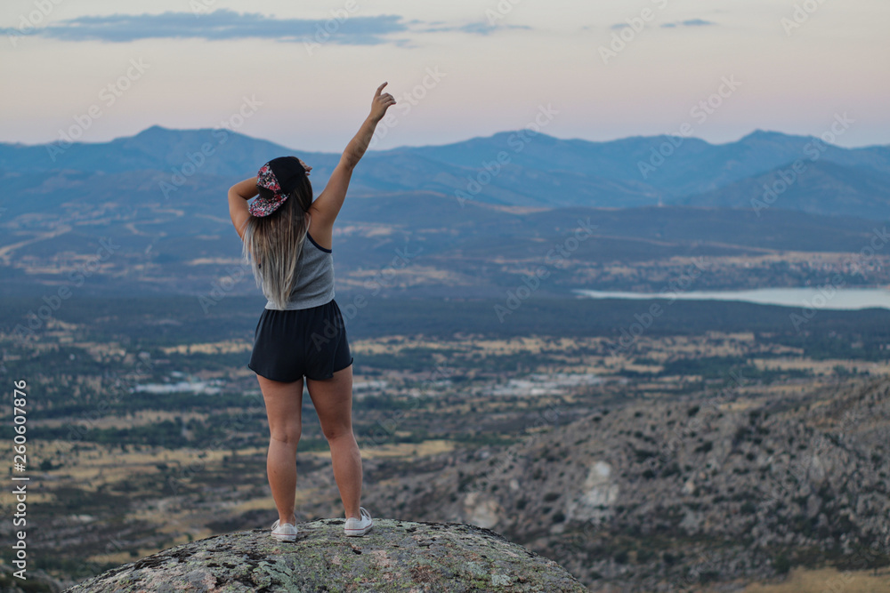Free girl with the cap back on the mountain Free girl with the cap back on the mountain