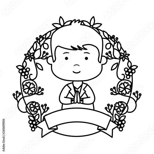little boy with wreath flowers first communion
