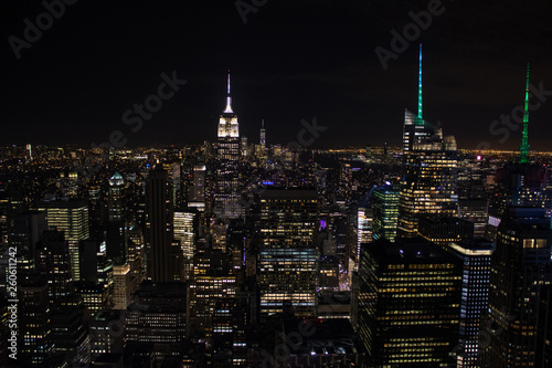 Night time aerial view of Manhattan in New York City showing the classic high rise buildings and city scape in the USA