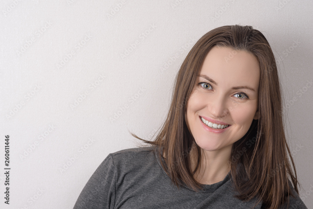 portrait of green-eyed brown-haired woman on light background portrait of green-eyed brown-haired woman on light background
