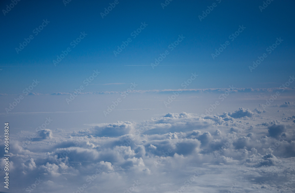 Fototapeta premium View from the airplane to the sky . Blue sky with clouds
