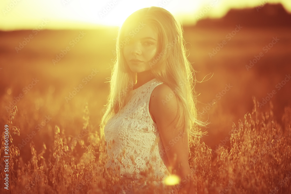 blonde long hair nature summer / happy adult girl with developing in the wind long blonde hair in the summer field blonde long hair nature summer / happy adult girl with developing in the wind long blonde hair in the summer field
