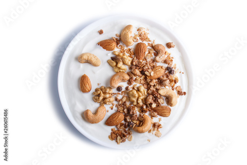 White plate with greek yogurt granola, almond, cashew, walnuts isolated on white background.