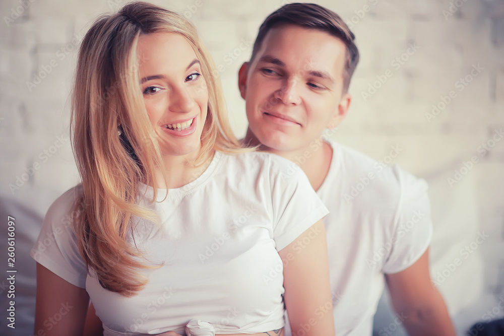 pregnancy man woman home comfort / concept of pregnancy childbirth, big belly, family, love and care pregnancy man woman home comfort / concept of pregnancy childbirth, big belly, family, love and care