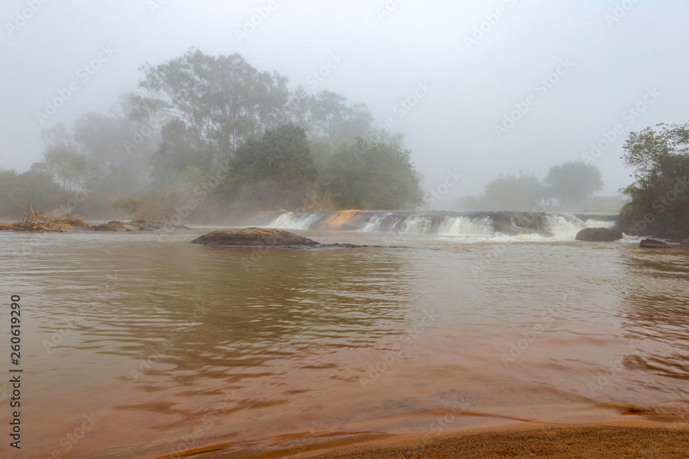 Vista de pequena queda d'água, chamada Cachoeira do Socó, no Rio Pomba, em área do município de Guarani, estado de Minas Gerais, Brasil