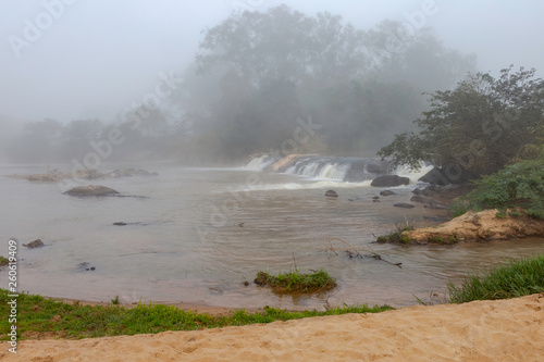 Vista de pequena queda d'água, chamada Cachoeira do Socó, no Rio Pomba, em área do município de Guarani, estado de Minas Gerais, Brasil