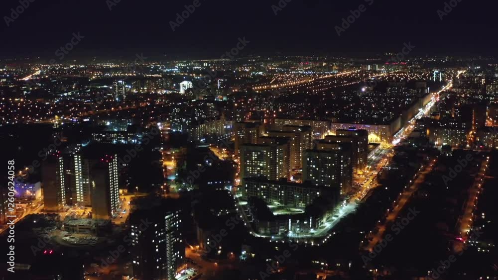 Aerial view, flight on drone above night city Voronezh with illuminated roads and buildings Aerial view, flight on drone above night city Voronezh with illuminated roads and buildings