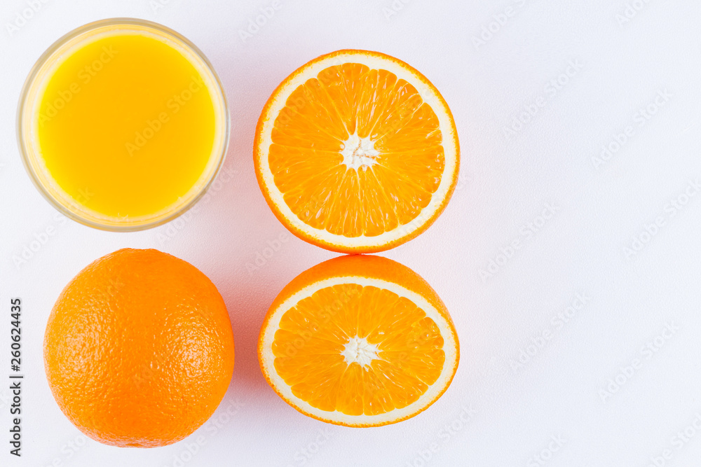 Orange fruits with juice, concept. Orange juice and halves of oranges on white background. Citrus for making juice. Whole and squeezed oranges and glass of juice Orange fruits with juice, concept. Orange juice and halves of oranges on white background. Citrus for making juice. Whole and squeezed oranges and glass of juice