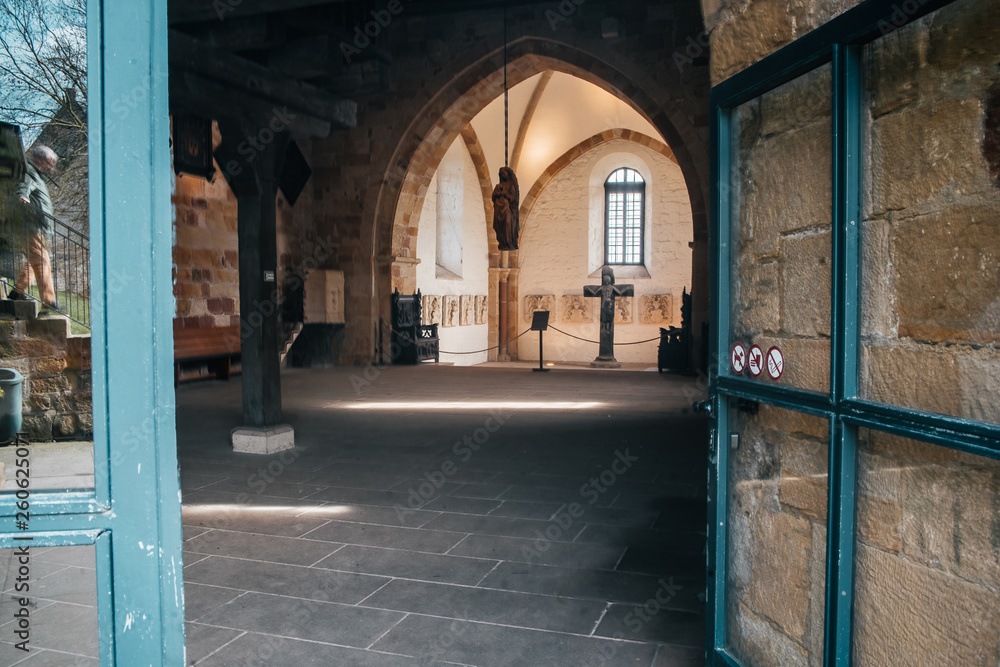 Catholic church interior with medieval walls and arch designed construction. Holy cross and gothic architecture Catholic church interior with medieval walls and arch designed construction. Holy cross and gothic architecture