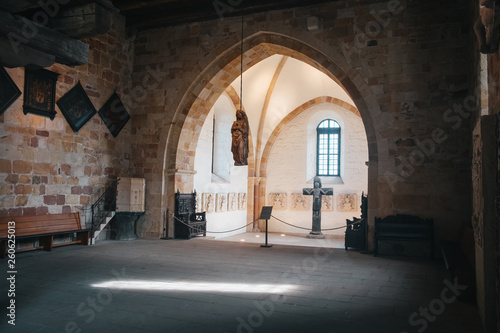 Catholic church interior with medieval walls and arch designed construction. Holy cross and gothic architecture © Aleksander