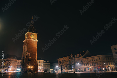  Town Hall Tower in Krakow, Poland. Night dusk shot of famous historic building