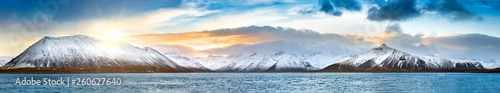 Icelandic winter panorama in Vesturland region with Lambahnukur, Gunnulfsfell, Snjogilskula, Kolgrafamuli mountain peaks behing Kolgrafafjordur fjord photo