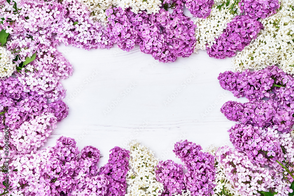 Floral pattern of lilac branches, flowers background. Flat lay, top view. Floral pattern of lilac branches, flowers background. Flat lay, top view.