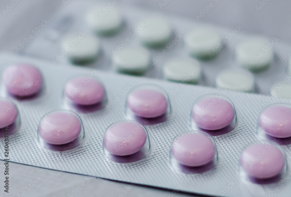 Pills for flu in the package close-up. The concept of treating colds, antidepressants, antibiotics, vitamin pills Pills for flu in the package close-up. The concept of treating colds, antidepressants, antibiotics, vitamin pills