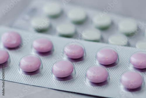 Pills for flu in the package close-up. The concept of treating colds, antidepressants, antibiotics, vitamin pills