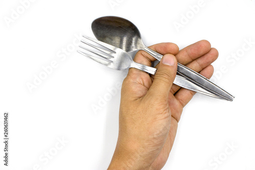 A male hand holding spoon and folk , man hand  isolated on white background © Nutt