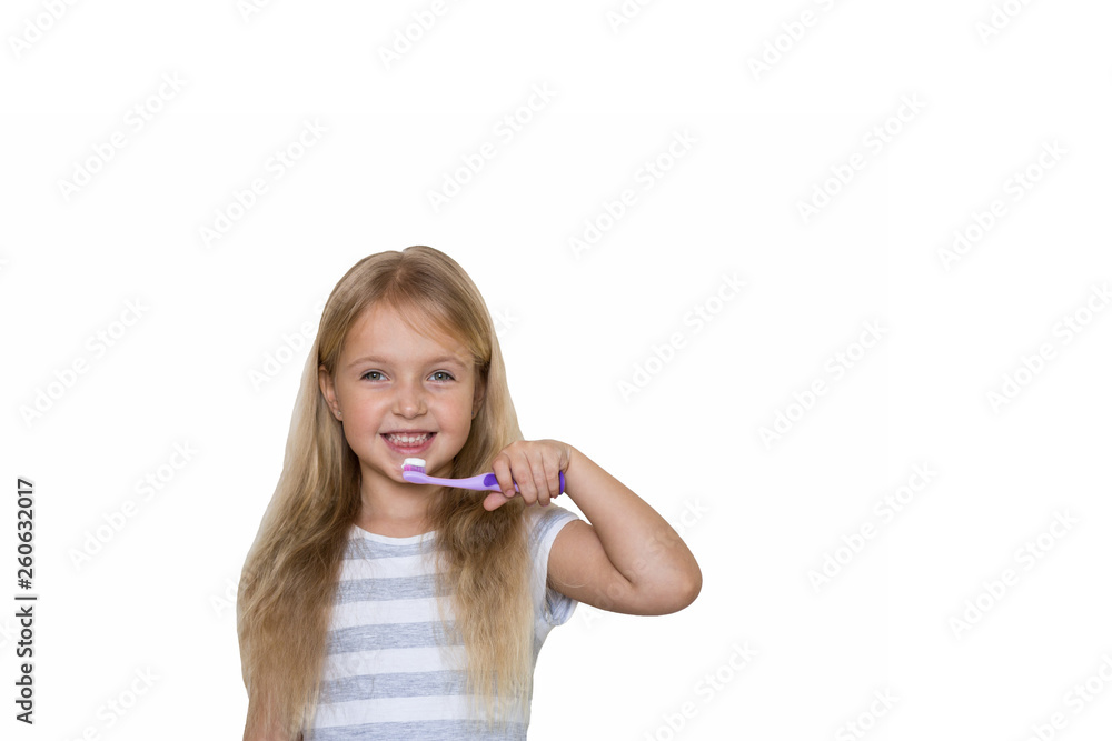 Portrait of cute little girl with blonde hair which cleaning tooth with brush and toothpaste isolated on white background Portrait of cute little girl with blonde hair which cleaning tooth with brush and toothpaste isolated on white background
