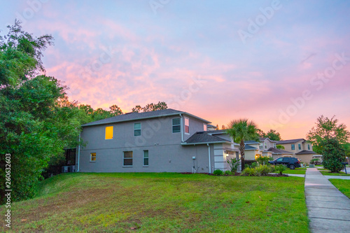 A typical Florida house at su set © Feng