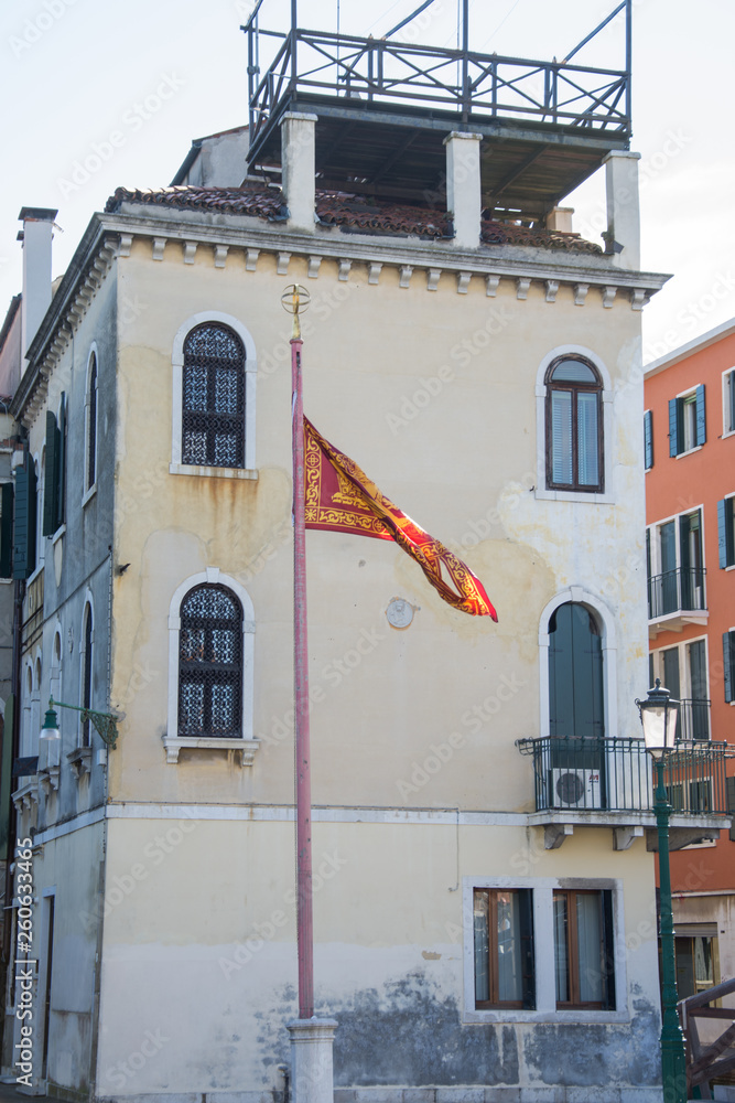 Fototapeta premium Venetian flag in Venice, Italy.march, 2019