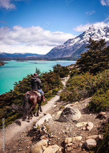 Riding in Patagonia. Man riding a horse in a snowy landscape. Enjoying nature in Patagonia, Chile.