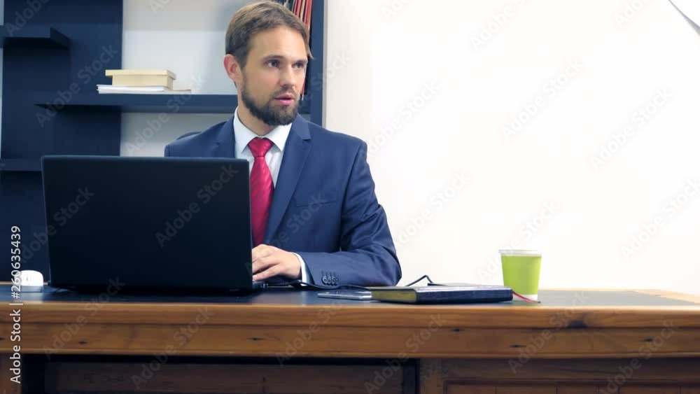 Office flirt. Attractive woman in a red jumpsuit, flirting at the table with her colleague. Office flirt. Attractive woman in a red jumpsuit, flirting at the table with her colleague.