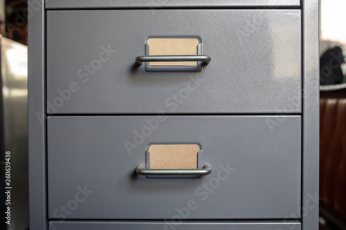 Canvas Print Filing cabinet with closed drawer, 2 brown cards for write letter, Grey silver m