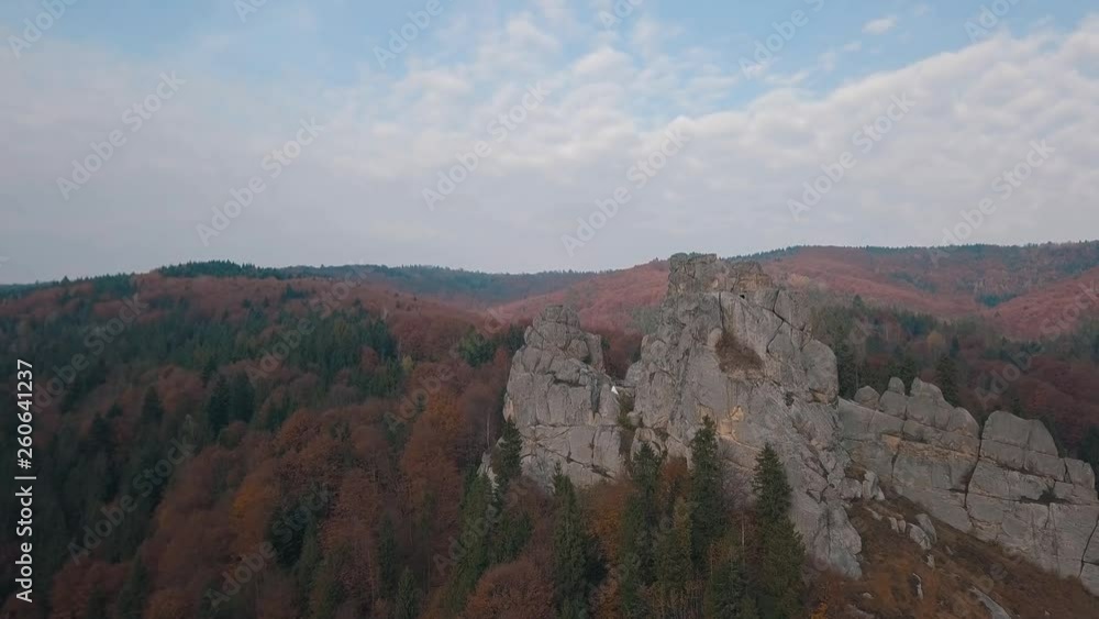 Impressive drone shot of the mountain hills in forest. Autumn. Aerial view Impressive drone shot of the mountain hills in forest. Autumn. Aerial view