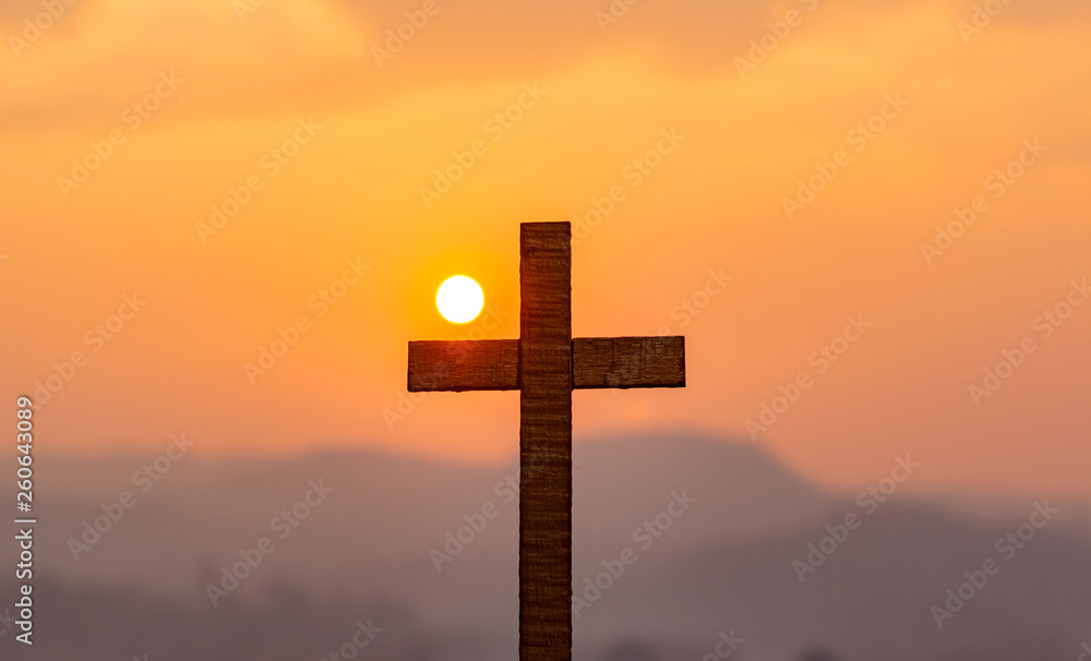 Silhouette cross on mountain at sunset background.Crucifixion Of Jesus Christ Silhouette cross on mountain at sunset background.Crucifixion Of Jesus Christ