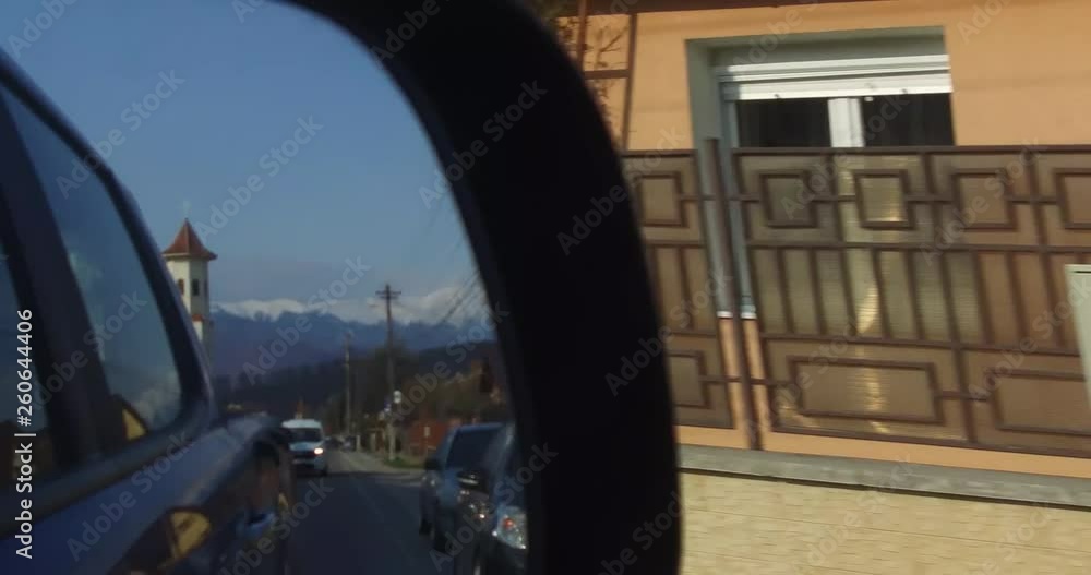 The back road seen in the rearview mirror The back road seen in the rearview mirror