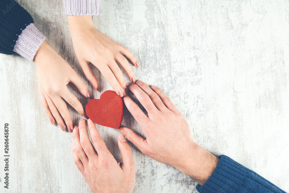 couple hand with heart on desk couple hand with heart on desk