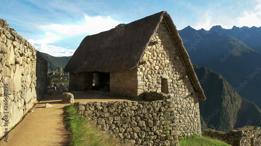 a reconstructed hut at machu picchu on a sunny morning a reconstructed hut at machu picchu on a sunny morning