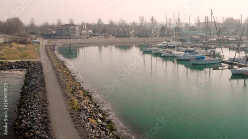 Aerial: Harbour and vacation park during hazy spring day. photo