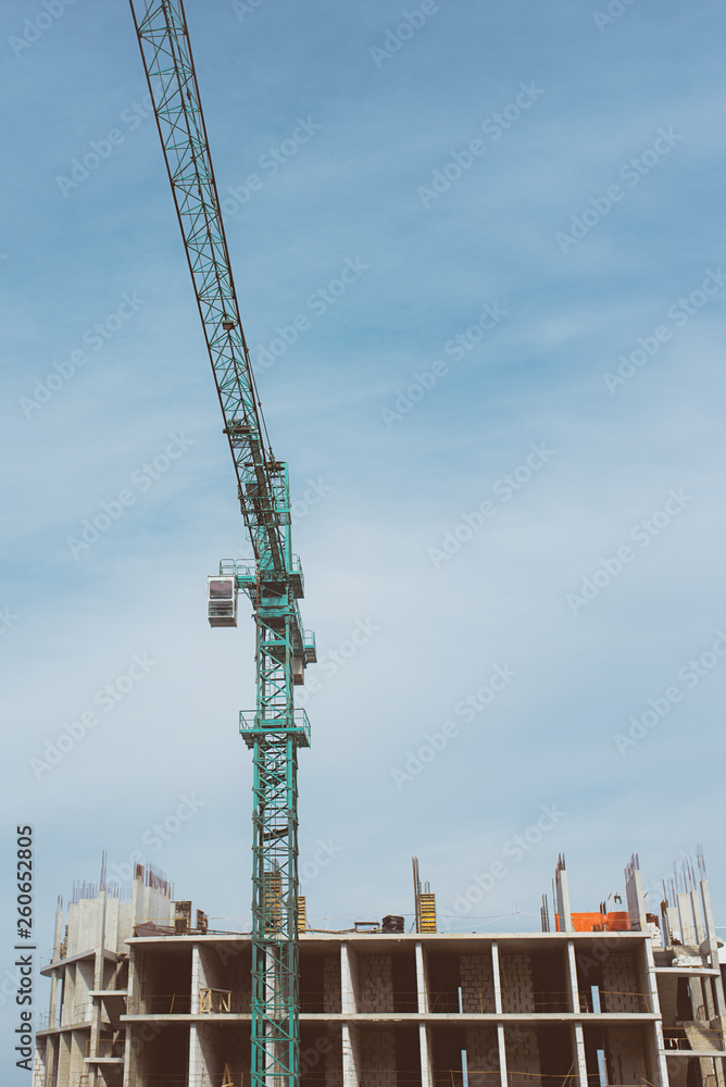Construction crane building new building outdoor. Urban story Construction crane building new building outdoor. Urban story
