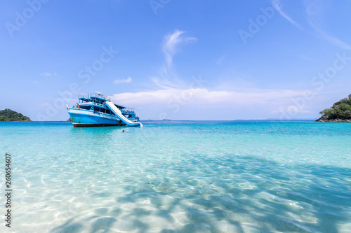 beautiful beach view Koh Chang island and Tour boat for tourists seascape at Trad province Eastern of Thailand on blue sky background , Sea island of Thailand landscape © suphaporn