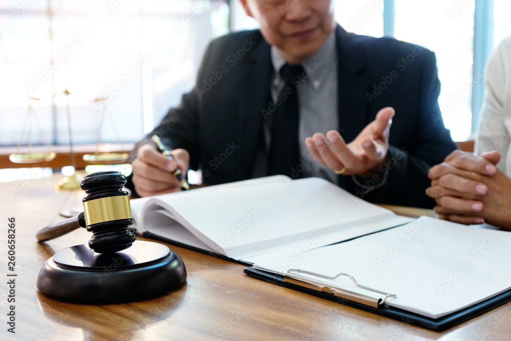 Judge or lawyer talking with team or client Judge or lawyer talking with team or client