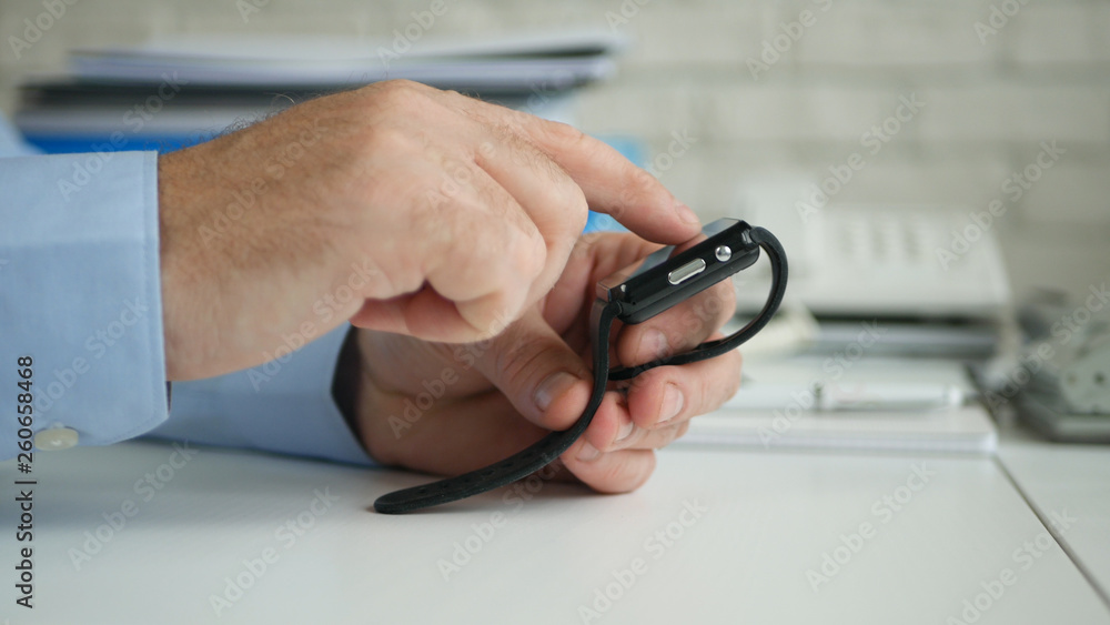 Businessman Image in Office Room Accessing Smartwatch Online Email Application Businessman Image in Office Room Accessing Smartwatch Online Email Application