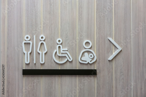 Modern restroom sign male, female, disability  and baby on wooden background
