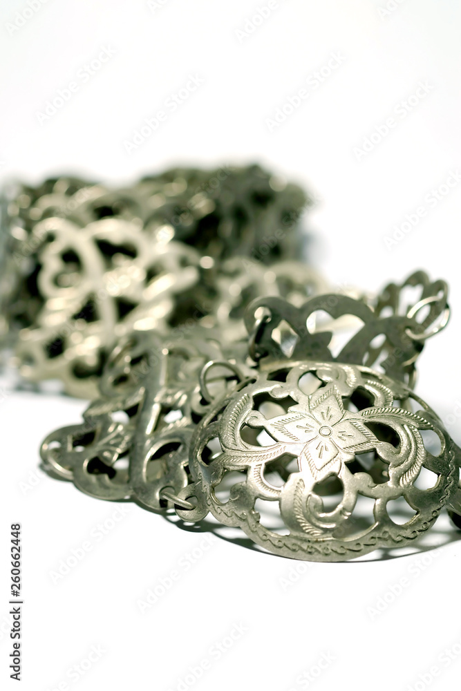 Isolate photo of ancient silver belt on white background with space for write wording, value woman accessories of Thai old generation woman more than 50 years ago. Beautiful unique style handcraft Isolate photo of ancient silver belt on white background with space for write wording, value woman accessories of Thai old generation woman more than 50 years ago. Beautiful unique style handcraft