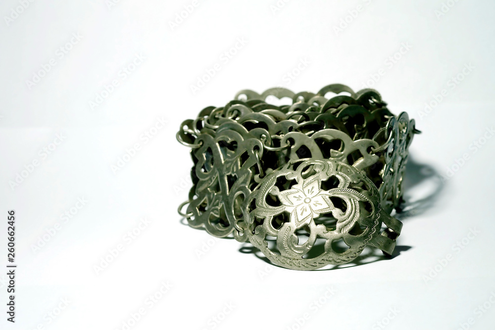 Isolate photo of ancient silver belt on white background with space for write wording, value woman accessories of Thai old generation woman more than 50 years ago. Beautiful unique style handcraft Isolate photo of ancient silver belt on white background with space for write wording, value woman accessories of Thai old generation woman more than 50 years ago. Beautiful unique style handcraft