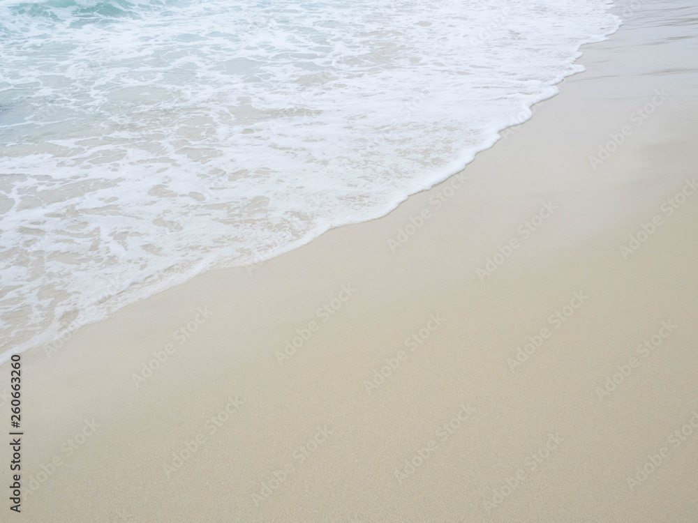 Sea water wave and water foam on beach background Sea water wave and water foam on beach background