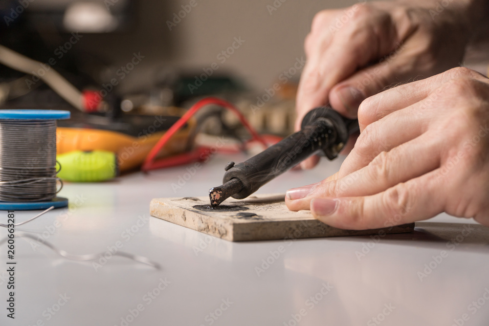 technician electrician prepares rosin soldering iron to work technician electrician prepares rosin soldering iron to work