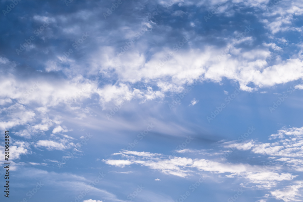 Obraz premium Blue sky with white clouds. Cloudy sky background. Space texture. Light background. Nature bright background. Natural cloudscape. 