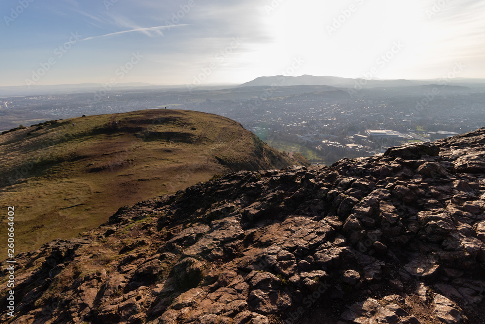 Obraz premium EDINBURGH, SCOTLAND, 20 February 2019, Cityscape of Edinburgh from Arthur's seat in beautiful February sunny day. Edinburgh, the most popular tourist city destination in Scotland